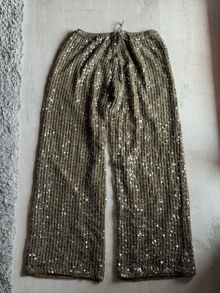 Pantalones de lentejuelas verdes y dorados