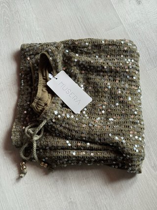 Pantalones de lentejuelas verdes y dorados