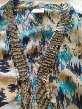 Top donna fantasia con perline