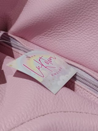 Bolso de piel rosa. Cierre de cremallera