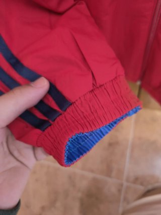 Cortavientos reversible de españa en azul/rojo