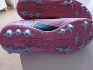 Zapatillas Nike niño naranja y rosa