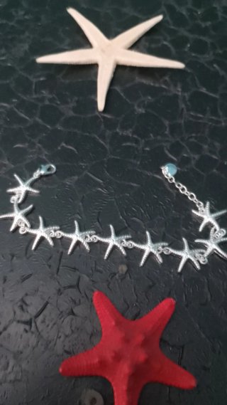 Conjunto : Pulsera Estrellas y anillo caracol