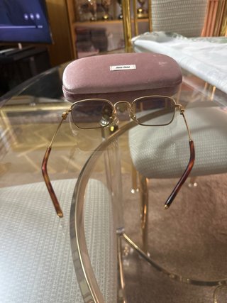 Gafas de sol Miu Miu doradas