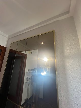Espejo de entrada dorado y cristal