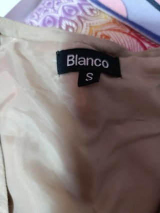 Chaleco corto beige y multicolor