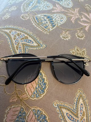Gafas de sol negras redondas