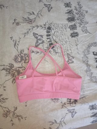 Top deportivo Reebok rosa