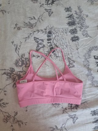 Top deportivo Reebok rosa