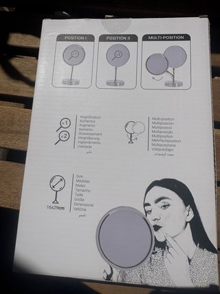 Espejo de maquillaje plateado y negro a estrenar