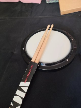 Pad de práctica de batería + baquetas