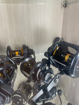 Mulinelli da pesca neri e oro