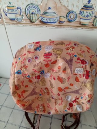 Bolso mochila estampado pájaros y scooter