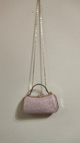 Bolso fiesta rosa con pedrería y asa dorada