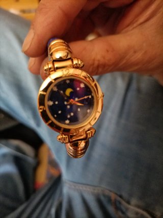 Orologio vintage con quadrante luna e stelle