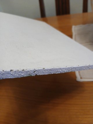 Eguzkilore sobre tabla de madera