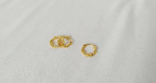Par aros entrelazados acero dorado