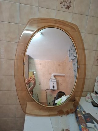 Espejo de pared ovalado marrón y transparente