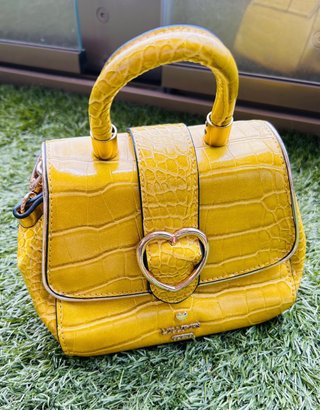 Bolso Lollipops amarillo con corazón dorado