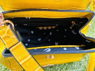 Bolso Lollipops amarillo con corazón dorado