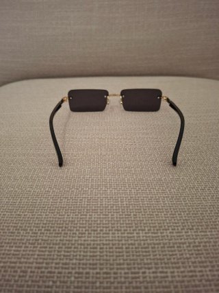 Occhiali da sole senza montatura oro nero