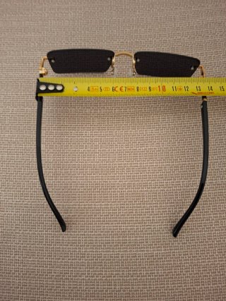 Occhiali da sole senza montatura oro nero