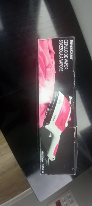 Plancha de vapor portátil rosa y blanca