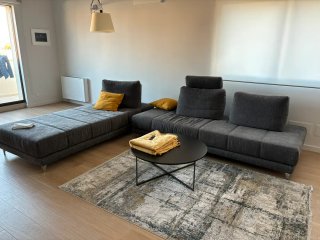 Divano componibile grigio tessuto