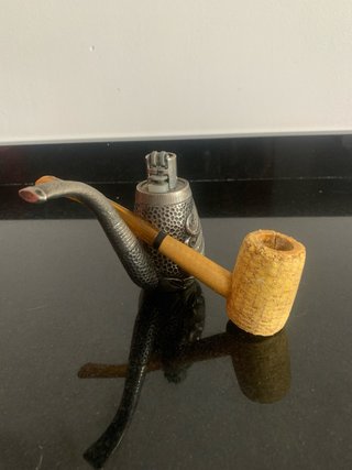 Pipa de maíz y pipa decorada con rostro mechero
