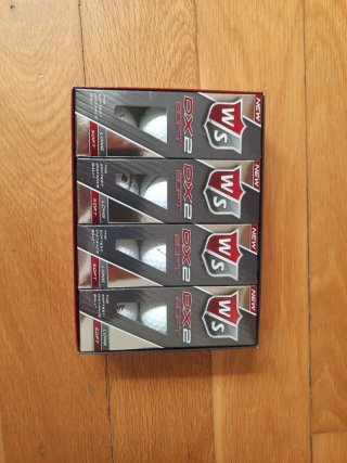 Caja 12 bolas wilson dx2 + Bolsa Tubo Golf Boomera