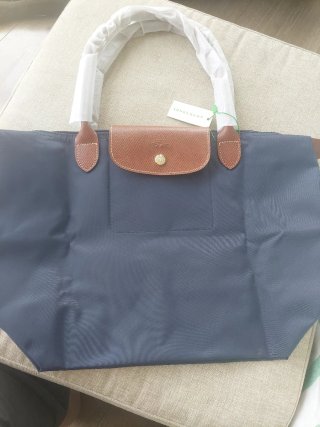 Bolso azul con detalles en marrón
