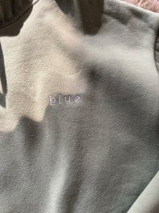 Sudadera verde con capucha