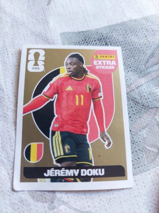 Cromo Jérémy Doku Mundial Panini Extra oro