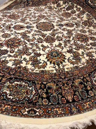 Alfombra redonda beige y negra