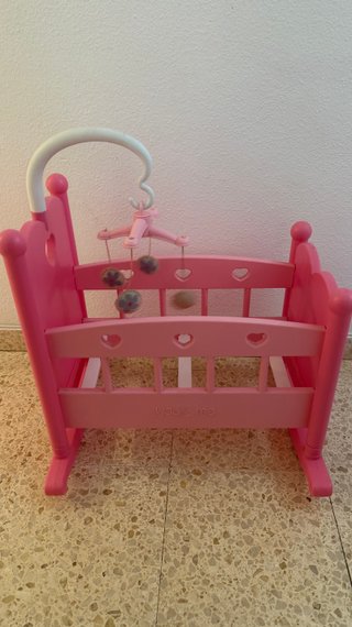 Cuna de juguete rosa