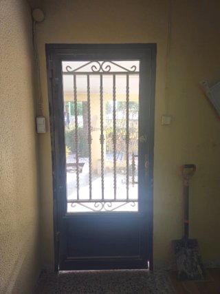 Puerta de forja hierro con cristal espejo