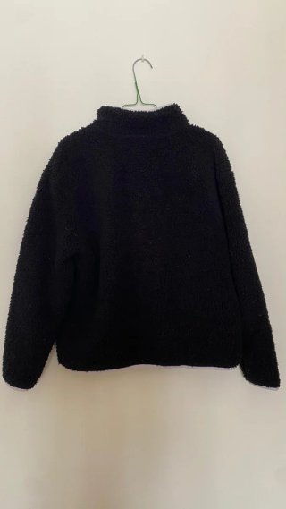 Forro polar Champion negro y rosa