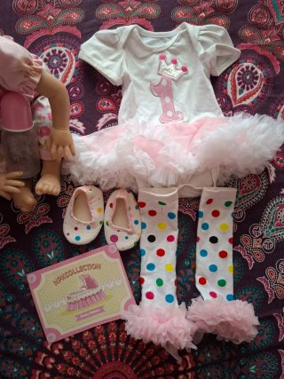 Bambola reborn vestita rosa