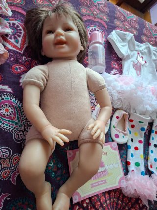 Bambola reborn vestita rosa