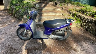 Soporte escape Honda Scoopy