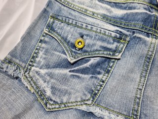 Minigonna vintage denim pieghe effetto sfrangiato