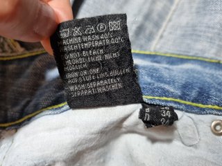 Minigonna vintage denim pieghe effetto sfrangiato