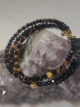 Bracciale rigido biconi neri e oro