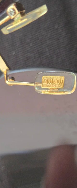 Gafas de sol Miu Miu Marrón y Dorado