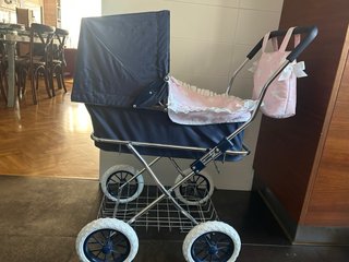 Carrito de bebé de juguete rosa estrellas
