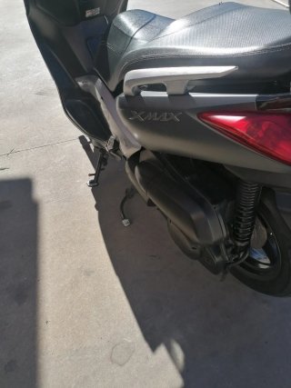 Moto bien conservada, es la XMAX 250 cc