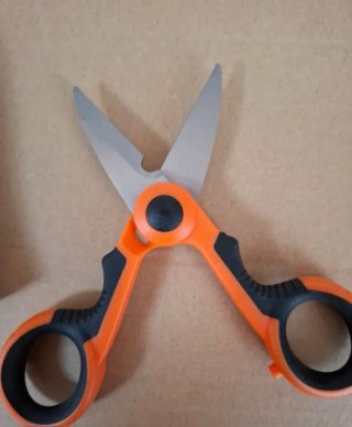 Tijeras profesionales naranja y negro