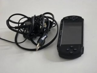 Sony PSP  Negra + Cargador + Juego