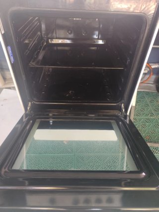 Cocina de gas con horno Indesit
