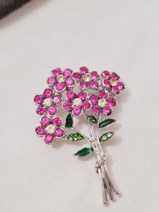 Spilla fiore con strass in metallo argentato